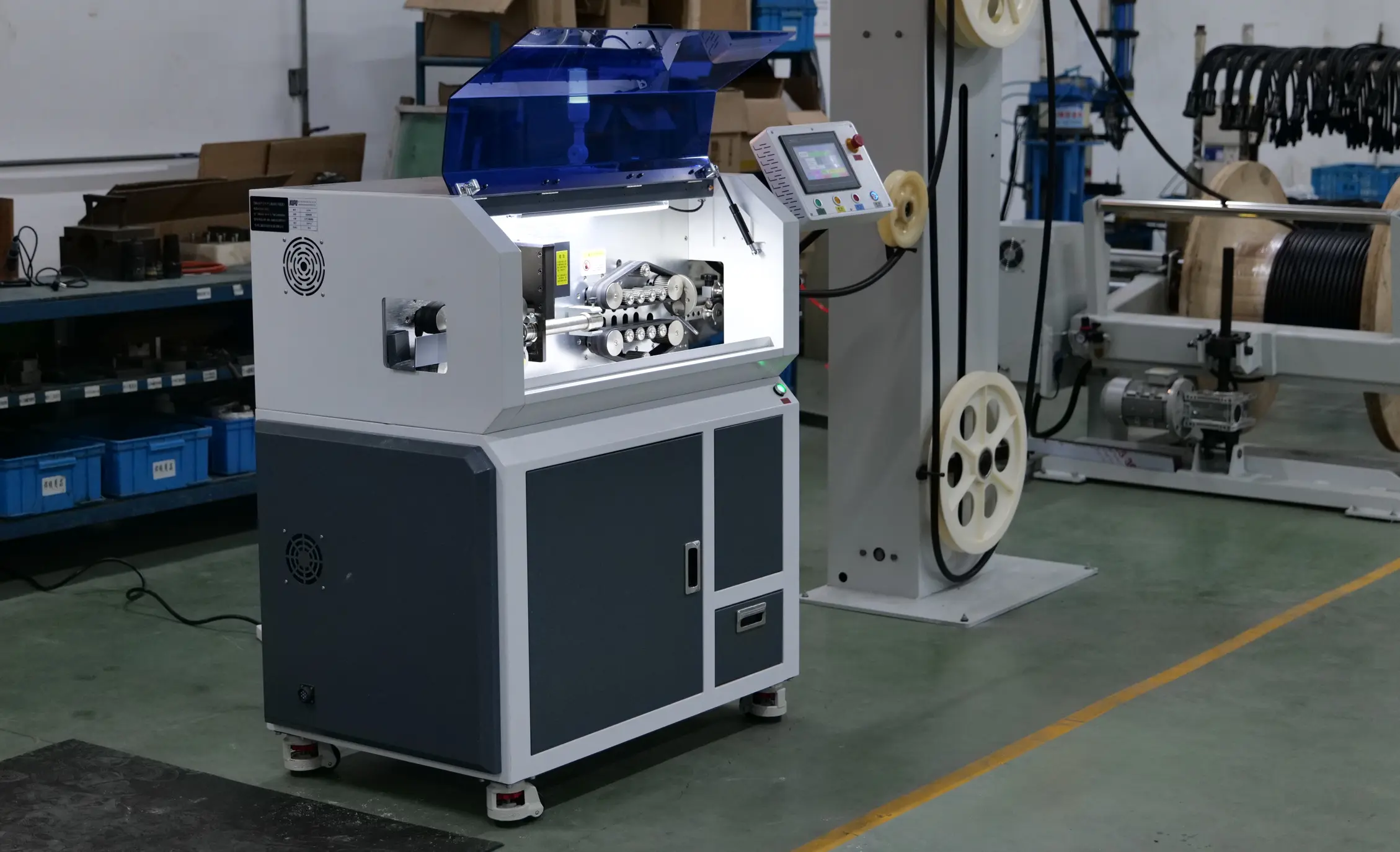Automated wire processing equipment on KUPO's production floor, used for precision cable assembly manufacturing